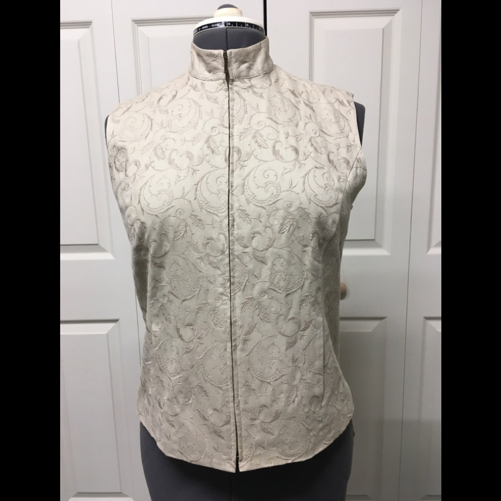 Beige cotton zipped lined vest.